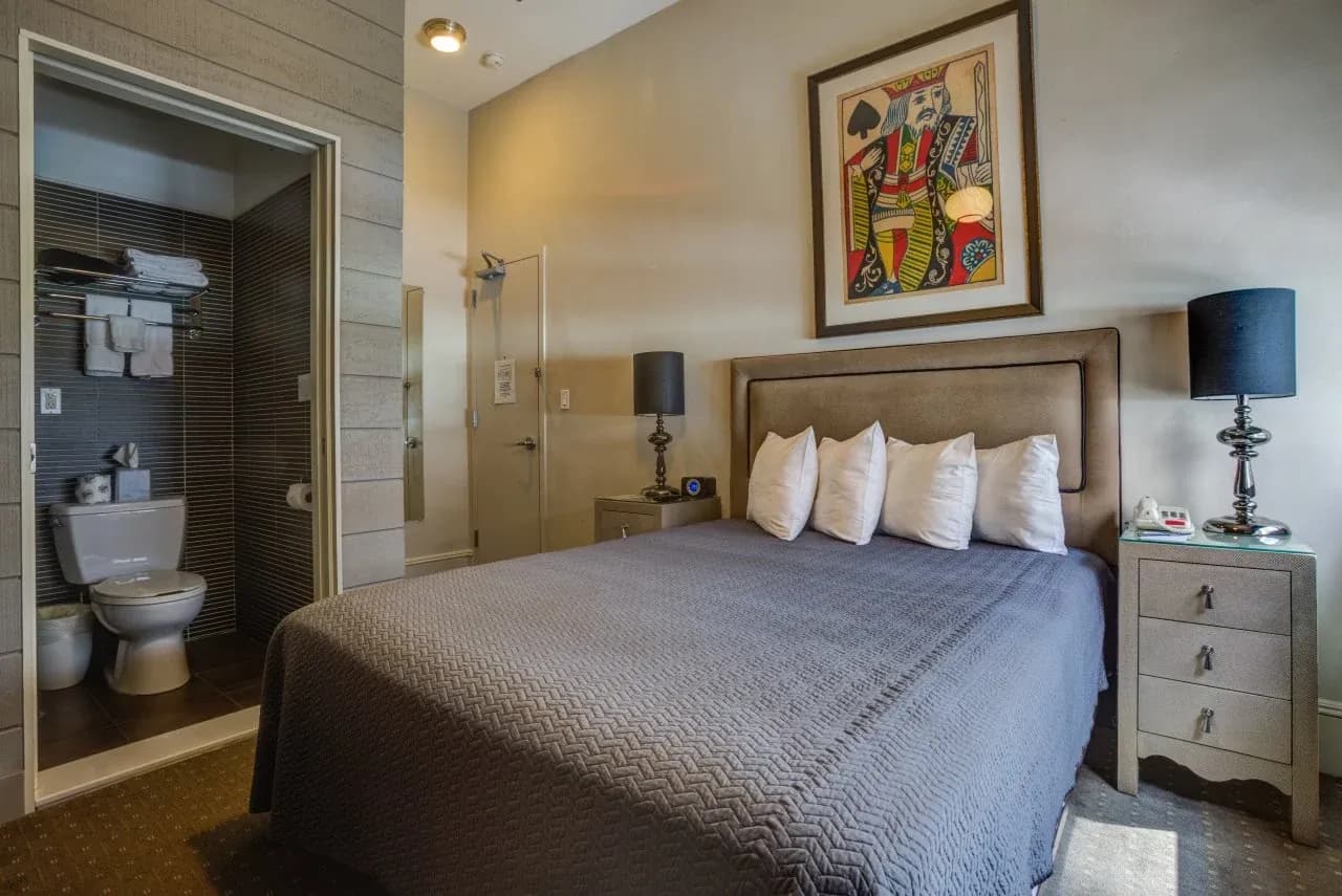 A King Studio with the en-suite bathroom visible through the doorway